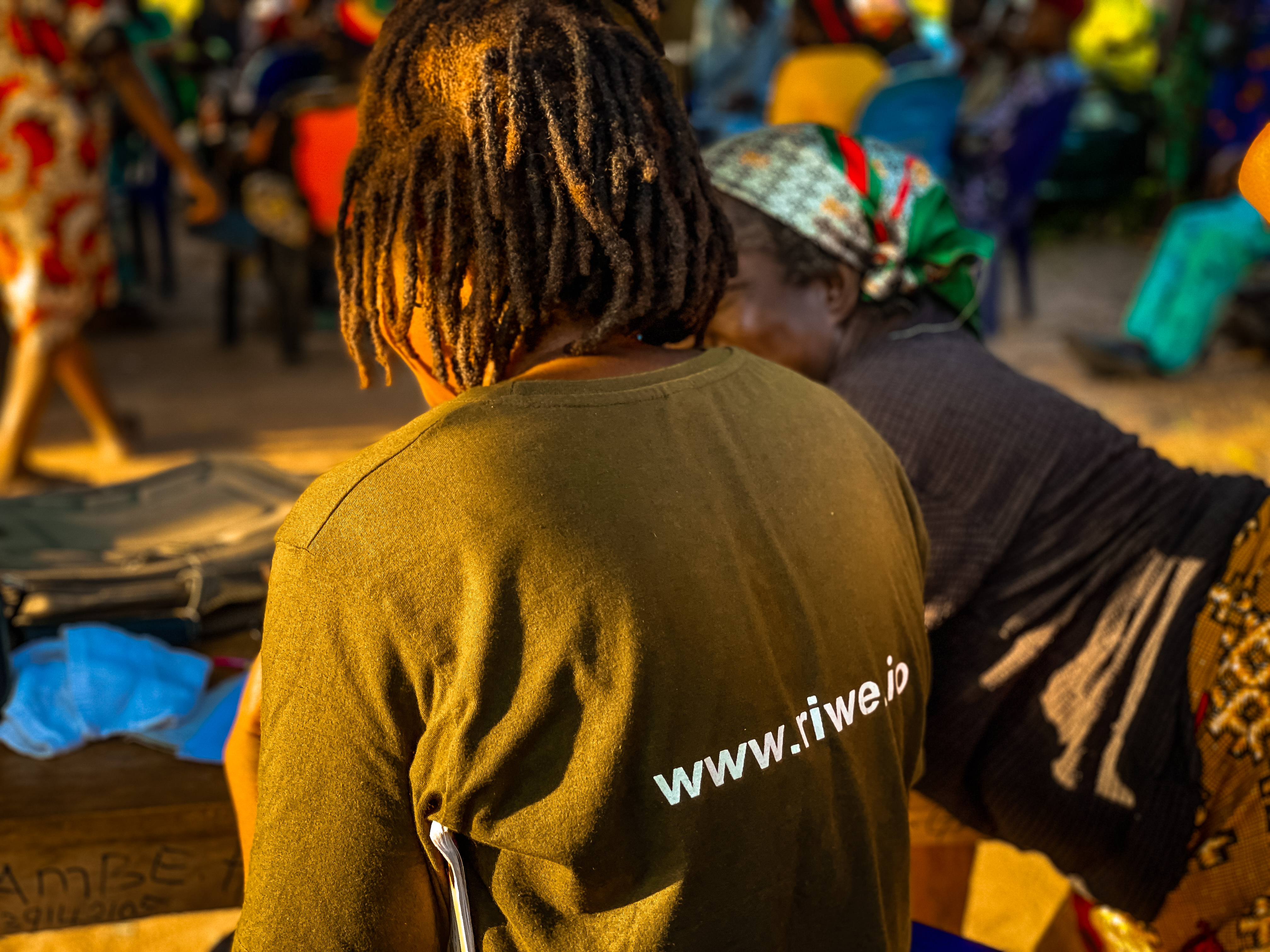Riwe team member engaging in community work